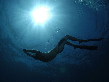 Freediver and sunburst with D100 on very high F stop and ... by Fiona Ayerst 