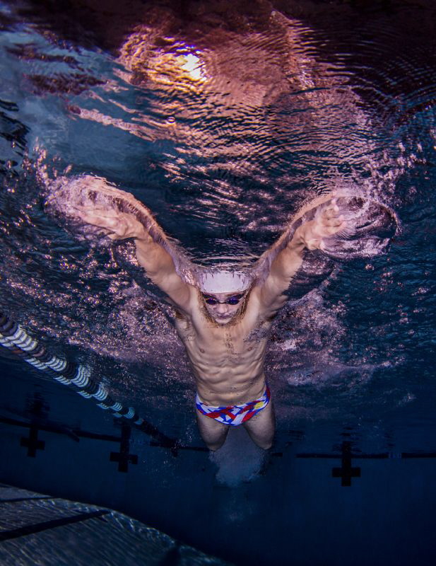 Elite College Swimmer performing butterfly by Ken Kiefer 