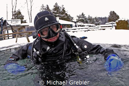 This ice diver has just completed his "bubble checks" wit... by Michael Grebler 