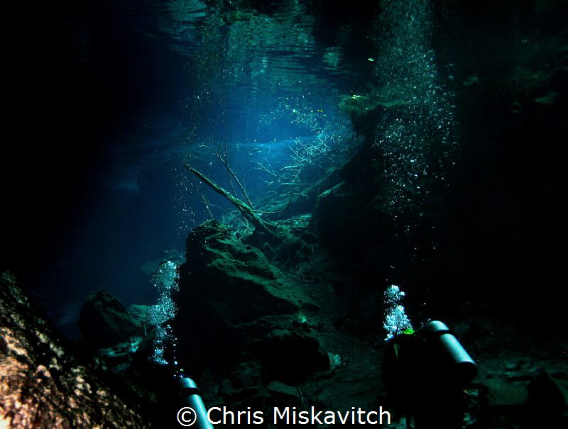 The last bit of light as divers enter the Cenote..... by Chris Miskavitch 