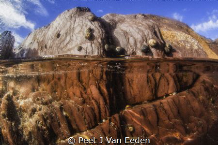 The rock pool by Peet J Van Eeden 