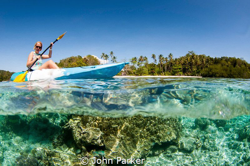 Canoe split Raja Ampat by John Parker 