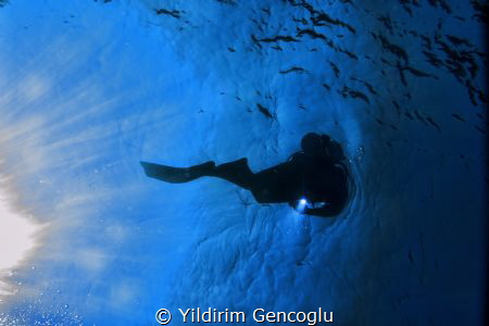 Diver sun&torch by Yildirim Gencoglu 