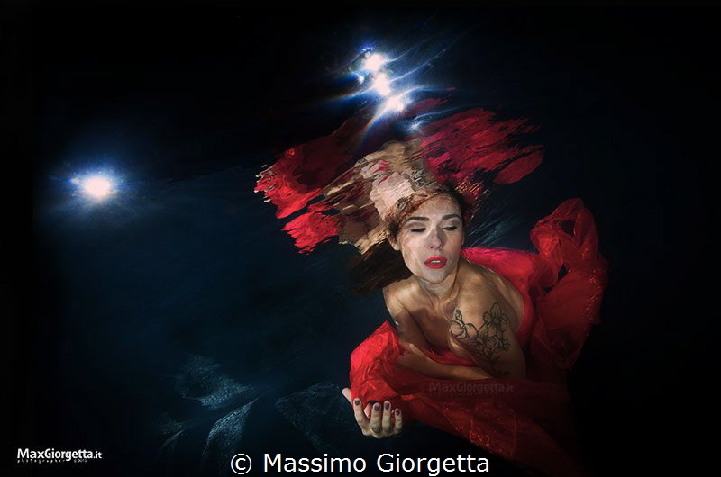 Underwater models in Italy - woman in red by Massimo Giorgetta 