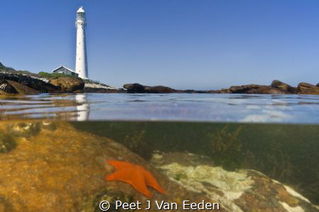 Guardian over the ocean life. A lighthouse at the Cape Pe... by Peet J Van Eeden 
