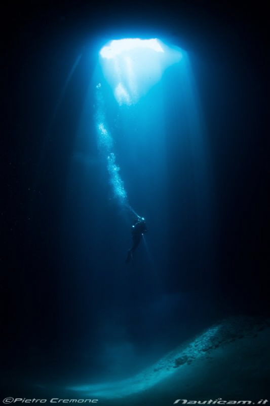 Diver in cave by Pietro Cremone 