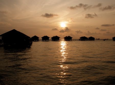 Sunrise at Sipadan Water Village, Mabul Island by Alex Lim 