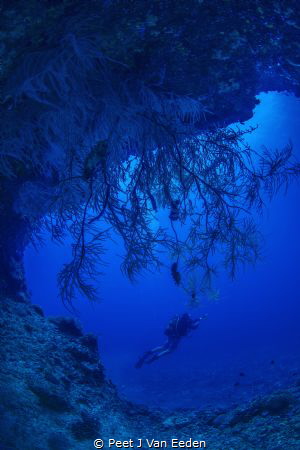 Into the deep blue caves of Situ island by Peet J Van Eeden 