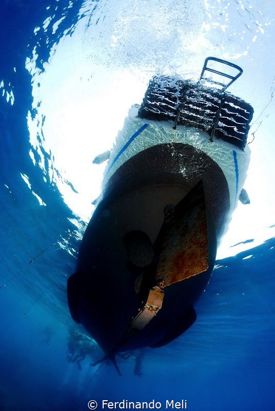 Diving boat attend divers... by Ferdinando Meli 