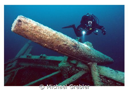 Diver at the starboard anchor of the Arabia lost near Tob... by Michael Grebler 