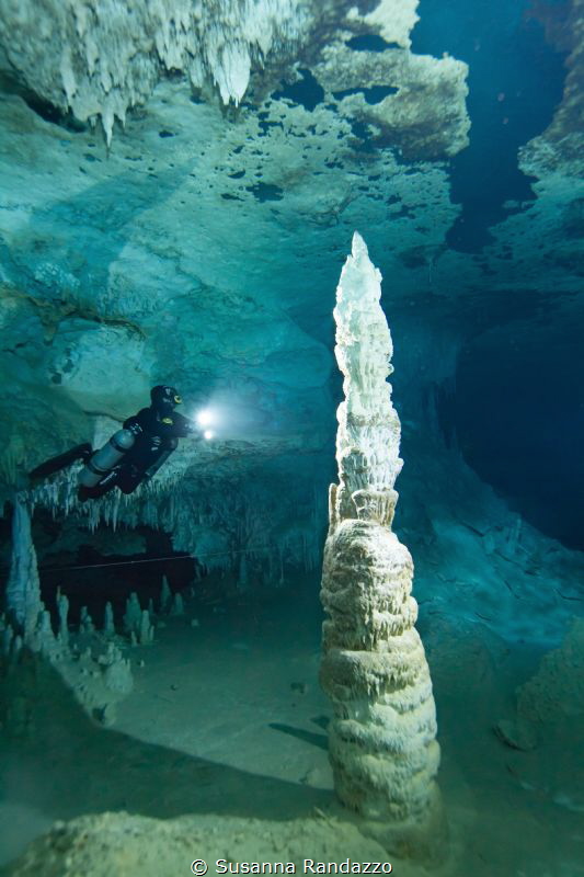 stalagmite with diver, cave diving, Mexico by Susanna Randazzo 
