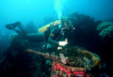 'SANKISAN' Diver checks deck gun ammo on Sankisan Maru - ... by Rick Tegeler 