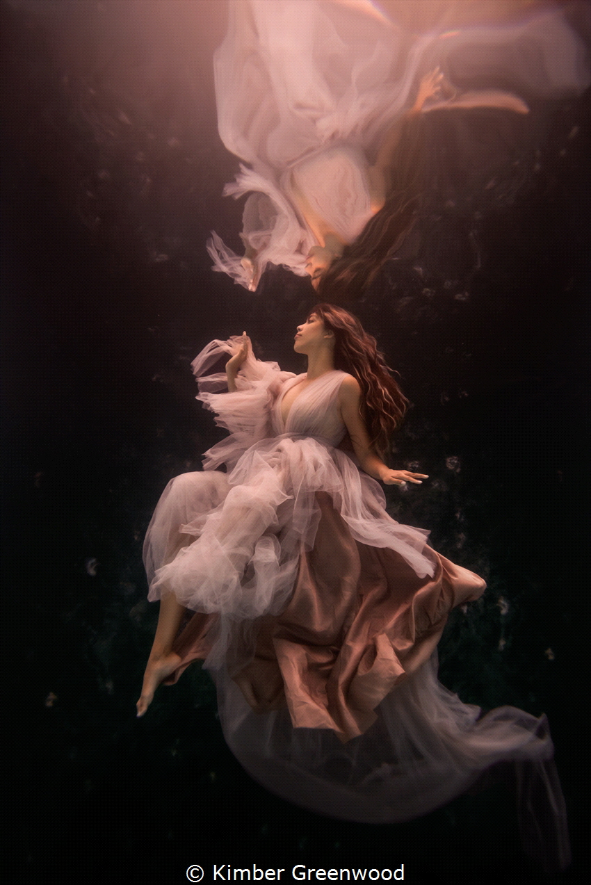 This underwater portrait of a beautiful woman was taken i... by Kimber Greenwood 