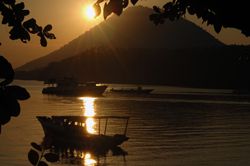 Sun setting behind Manado Tua.Shot taken from Bunaken. D7... by Frankie Tsen 