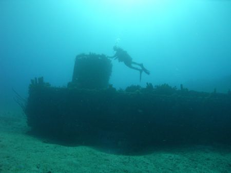A sunk Mike Boat in the GTMO waters by Lora Tucker 