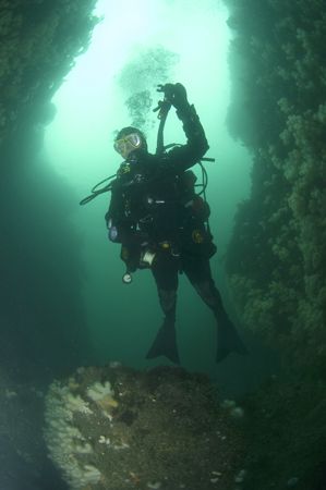 Diver in Gully at Wuddy Rock, St. Abbs, Scotland. 10.5mm ... by Mike Clark 