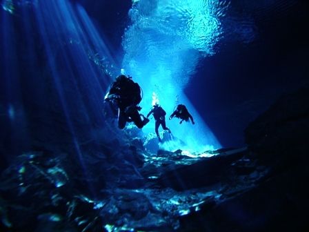 Divers exploring the cave system of Chac Mool. Fresh wate... by Kenn Bolbjerg 