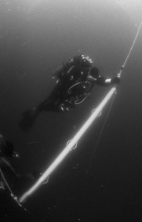 A Nova Scotia Tech Diver waits out his decompression on a... by Michael Grebler 