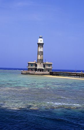 Daedalus reef lighthouse. F50,60mm. by Derek Haslam 