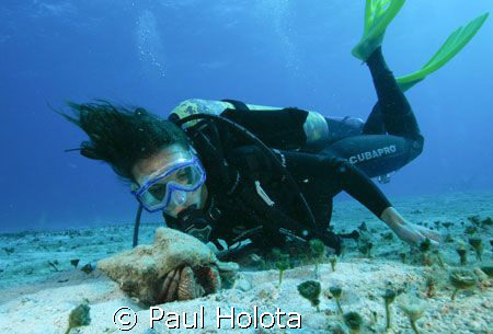Christina gets up close to a hermit crab. Cozumel. Canon ... by Paul Holota 