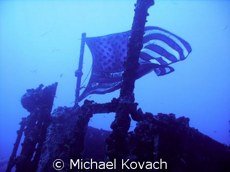 Flag on the wreck of the Duane out of Key Largo. by Michael Kovach 