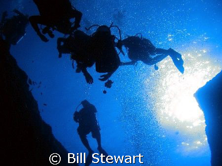 Divers ascending from the Blue Hole.  Photo taken on 8 De... by Bill Stewart 