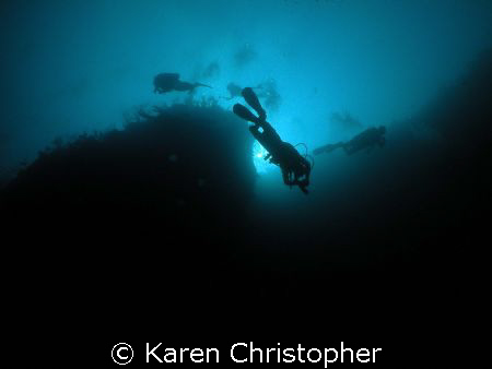 Divers descend one of the walls off Laguna Beach resort i... by Karen Christopher 