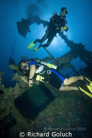 Divers cheking out Nippo Maru-Truk Lagoon by Richard Goluch 