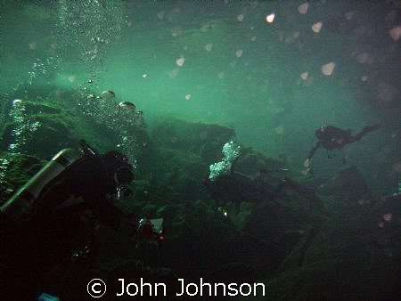 diving in the cenotes of playa del carmen by John Johnson 