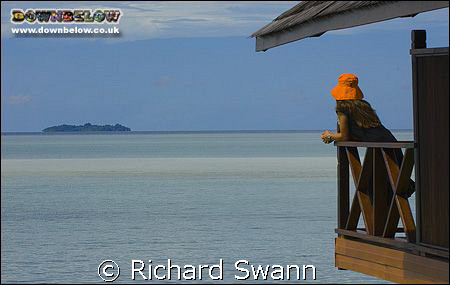 View of Sipadan island and my wife's orange hat from our ... by Richard Swann 