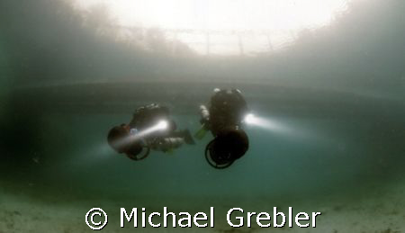 Divers on DPV pass under the floating bridge in Morrisons... by Michael Grebler 