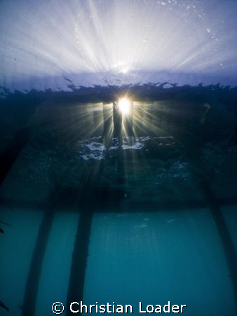 sunburst under the jetty in the morning. Olympus SP-350, ... by Christian Loader 