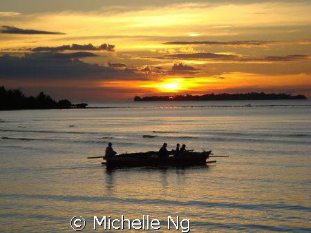 Sunset at the Kima Bajo village, Manado. Fishermen starte... by Michelle Ng 