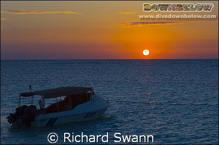 Sunrise over our dive boat, Lankayan island Sabah Borneo.... by Richard Swann 
