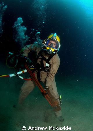 US Navy diver with a small wrench. by Andrew Mckaskle 