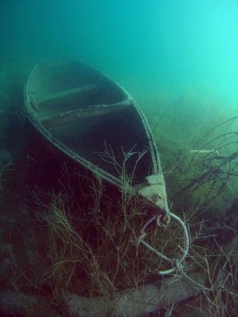 Small wreck of a boat on large Austrian lake Attersee.  by Alena Vorackova
 