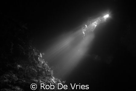 Sunlight in a cave in "the passage" Rajah Ampat, Papua by Rob De Vries 