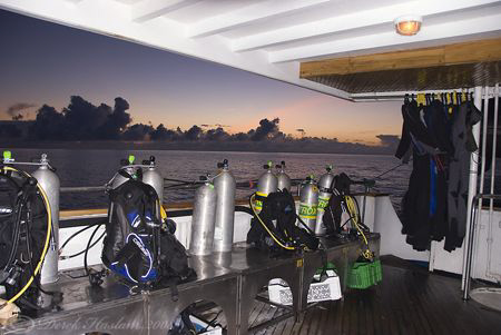 Dive deck at sunrise. Sky Dancer. Galapagos. by Derek Haslam 