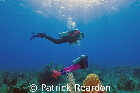 My daughter and wife in the crystal waters of Grand Cayma... by Patrick Reardon 