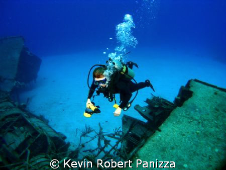 Wendy photographing a Sunken Destroyer in Cayman Brac.
C... by Kevin Robert Panizza 