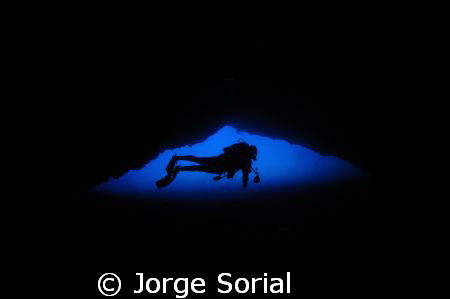 My buddy Vicente floating in the blue from inside the Mor... by Jorge Sorial 