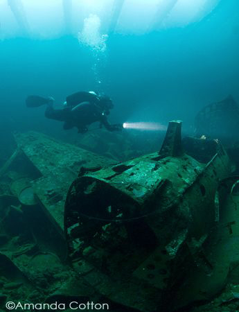Diver above Japanese Zero inside cargo hold of Fujikawa M... by Amanda Cotton 