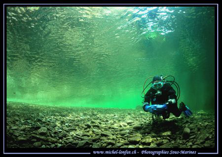 My wife at the entrance of a Dive Site in the River Mal-M... by Michel Lonfat 