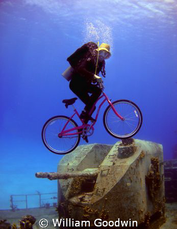 The "E.T." shot - riding a bike over the guns of the M/V ... by William Goodwin 