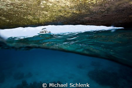 The view of inside looking out of "The Blue Cave" Curacao... by Michael Schlenk 
