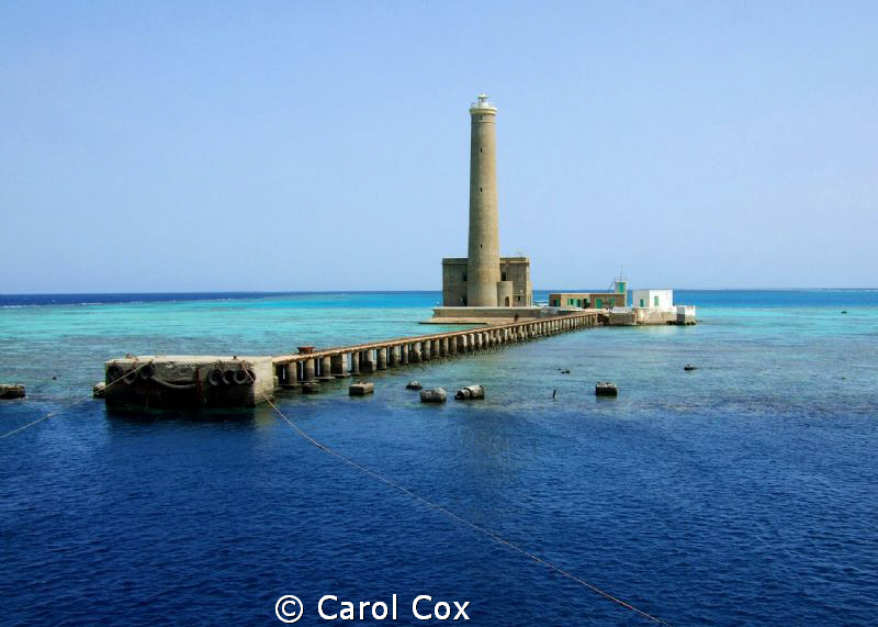 This is the Sanganeab Lighthouse in Sudan's Red Sea.  We ... by Carol Cox 
