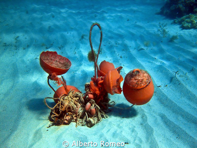 Some broken buoys on seabed. by Alberto Romeo 