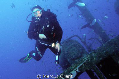A diver on the wreck of the Rozi by Marcus Grant 