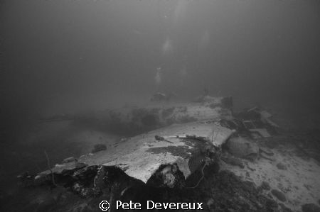 "Betty" bomber in Chuuk Lagoon with diver in background. by Pete Devereux 