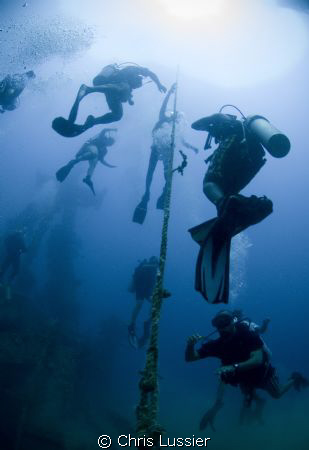 Divers ascending after exploring the stavronikita (shipwr... by Chris Lussier 